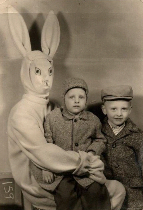 Alien-like easter bunny with two children