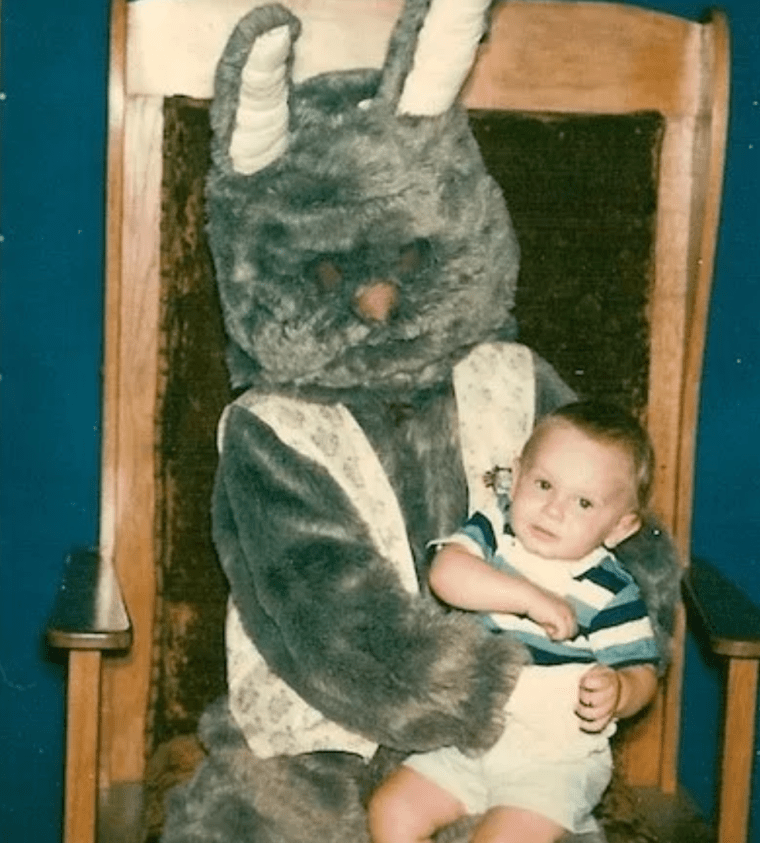 woolly easter bunny isn't going to let go of child